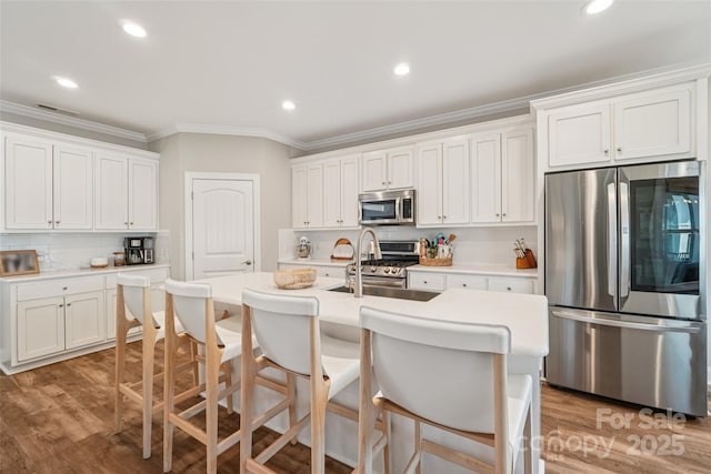 347 Landing Trl, Mount Gilead, NC 27306 - kitchen featuring stainless steel appliances, ornamental molding, backsplash, light countertops, and recessed lighting