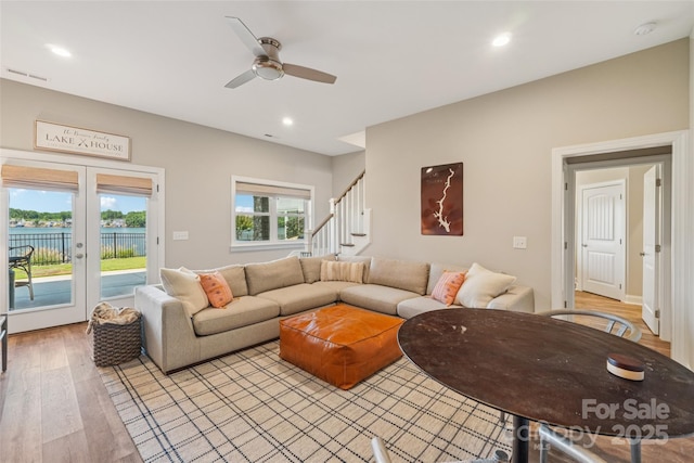 347 Landing Trl, Mount Gilead, NC 27306 - living room with light wood-style floors, stairway, a ceiling fan, recessed lighting, and french doors
