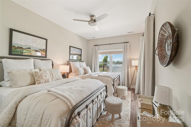 347 Landing Trl, Mount Gilead, NC 27306 - bedroom with a ceiling fan and a water view