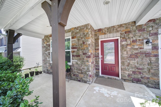 10328 Ebbets Rd, Charlotte, NC 28273 - doorway to property featuring a porch and stone siding