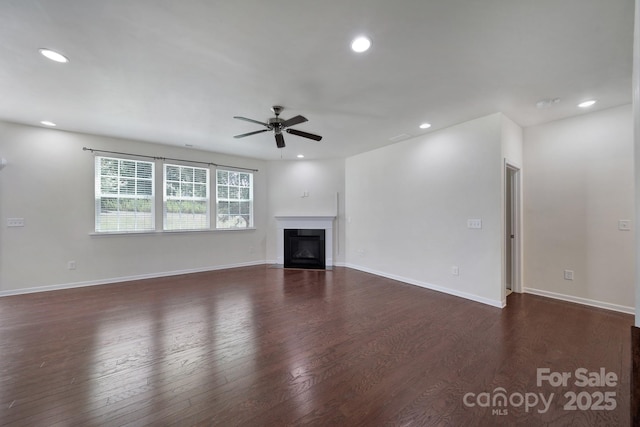 10328 Ebbets Rd, Charlotte, NC 28273 - unfurnished living room with ceiling fan, recessed lighting, dark wood-style flooring, and a fireplace with flush hearth