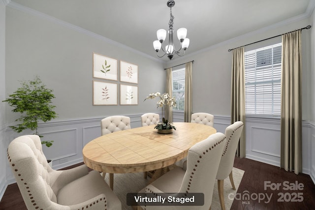 10328 Ebbets Rd, Charlotte, NC 28273 - dining room featuring a chandelier, dark wood finished floors, ornamental molding, wainscoting, and a decorative wall