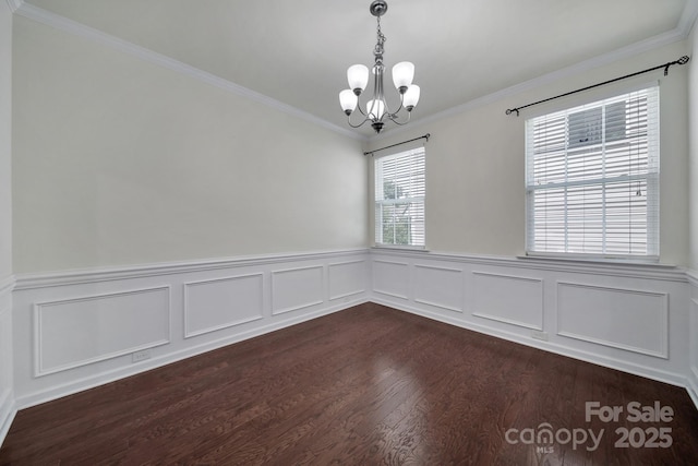 10328 Ebbets Rd, Charlotte, NC 28273 - unfurnished room with a chandelier, dark wood-style flooring, crown molding, and a wainscoted wall