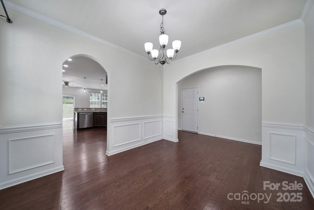 10328 Ebbets Rd, Charlotte, NC 28273 - empty room featuring arched walkways, a chandelier, a decorative wall, ornamental molding, and dark wood-type flooring