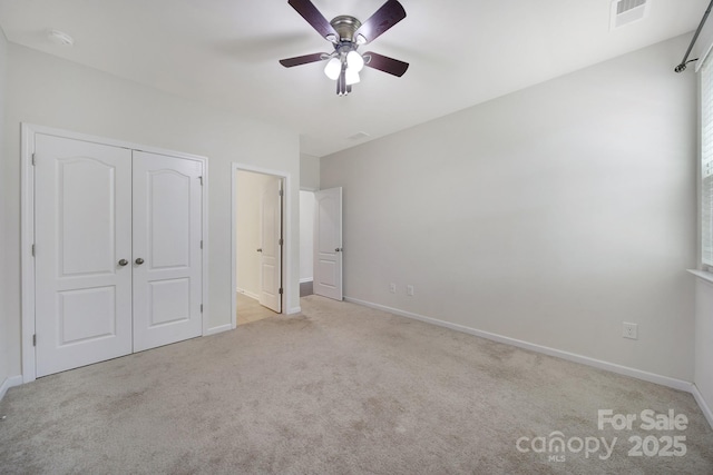 10328 Ebbets Rd, Charlotte, NC 28273 - unfurnished bedroom featuring carpet, a closet, and a ceiling fan