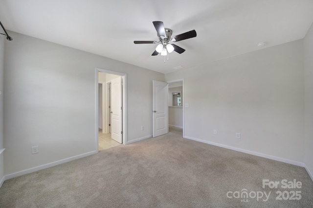 10328 Ebbets Rd, Charlotte, NC 28273 - unfurnished bedroom with light colored carpet, ensuite bath, and ceiling fan