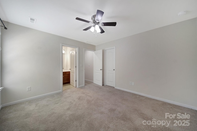 10328 Ebbets Rd, Charlotte, NC 28273 - unfurnished bedroom featuring light colored carpet, connected bathroom, and ceiling fan