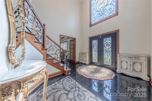3100 Shady Grove Ln, Matthews, NC 28104 - foyer entrance featuring french doors, plenty of natural light, granite floors, stairs, and a high ceiling