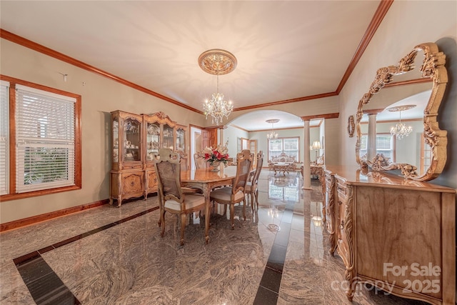 3100 Shady Grove Ln, Matthews, NC 28104 - dining space with a chandelier, crown molding, decorative columns, arched walkways, and granite tiled floors