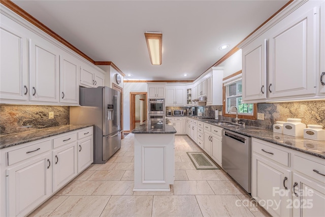 3100 Shady Grove Ln, Matthews, NC 28104 - kitchen with stainless steel appliances, white cabinets, tasteful backsplash, crown molding, and recessed lighting