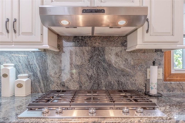 3100 Shady Grove Ln, Matthews, NC 28104 - kitchen with extractor fan, stainless steel gas cooktop, backsplash, and white cabinets