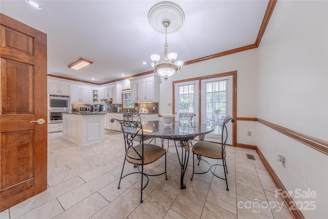 3100 Shady Grove Ln, Matthews, NC 28104 - dining space with ornamental molding, a chandelier, and recessed lighting