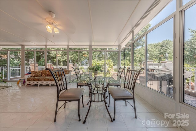 3100 Shady Grove Ln, Matthews, NC 28104 - sunroom / solarium featuring plenty of natural light, tile patterned floors, ceiling fan, and a wall of windows