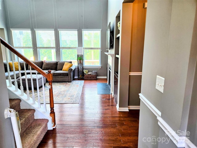 10302 Newbridge Rd, Charlotte, NC 28278 - living room featuring dark wood finished floors, stairs, and a fireplace