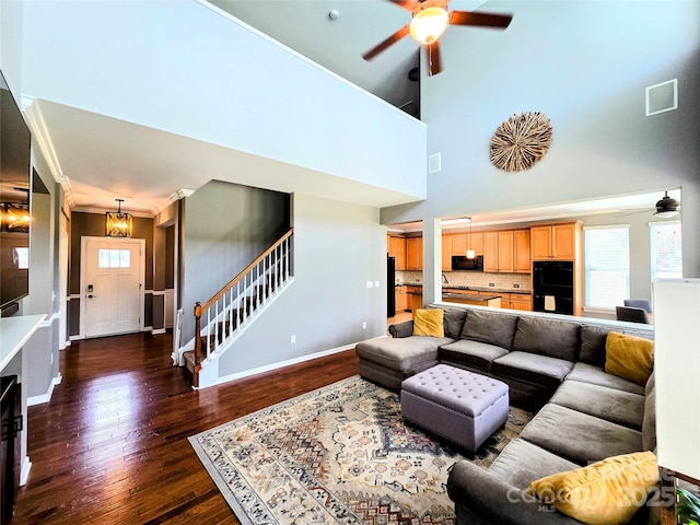 10302 Newbridge Rd, Charlotte, NC 28278 - living area with ceiling fan, stairway, dark wood finished floors, and a high ceiling