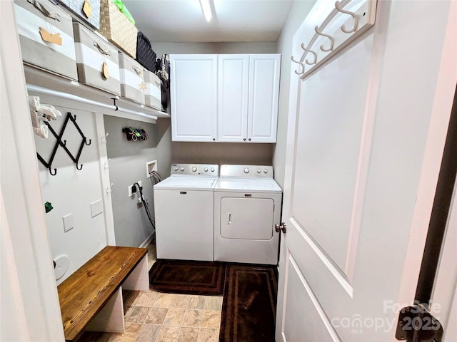10302 Newbridge Rd, Charlotte, NC 28278 - laundry room featuring cabinet space, washer and dryer, and stone finish floors