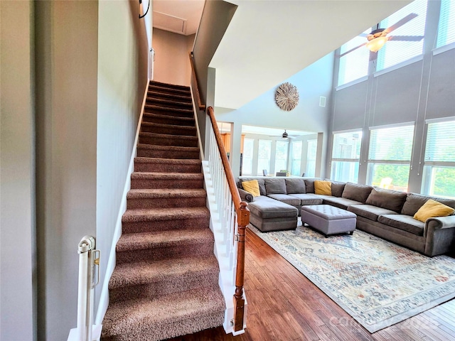 10302 Newbridge Rd, Charlotte, NC 28278 - stairs with a towering ceiling, healthy amount of natural light, wood finished floors, and ceiling fan