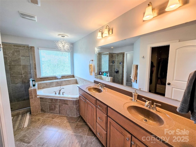 10302 Newbridge Rd, Charlotte, NC 28278 - full bathroom with a shower stall, double vanity, a bath, a walk in closet, and tile patterned floors