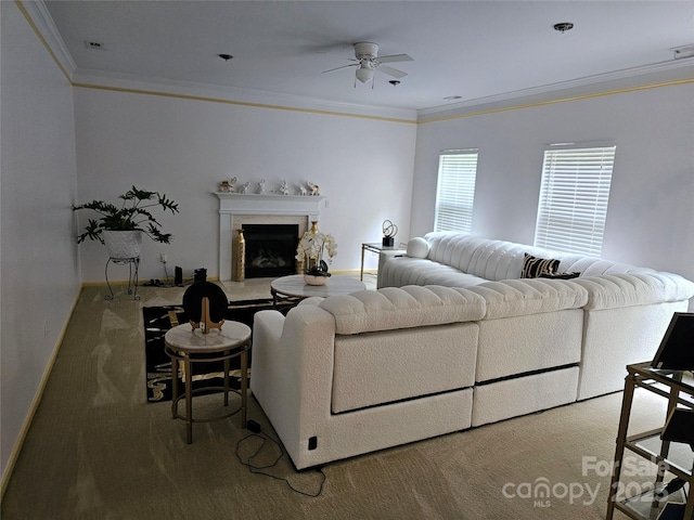 935 Wind Carved Ln, Monroe, NC 28110 - living room featuring a ceiling fan, ornamental molding, and a fireplace with raised hearth