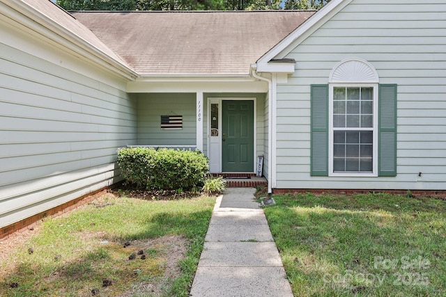 11100 Scrimshaw Ln, Charlotte, NC 28215 - property entrance with a lawn and a shingled roof
