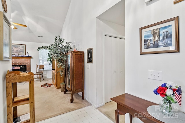 11100 Scrimshaw Ln, Charlotte, NC 28215 - corridor featuring light carpet, vaulted ceiling, and light flooring