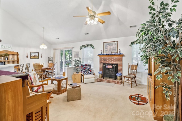 11100 Scrimshaw Ln, Charlotte, NC 28215 - carpeted living room featuring vaulted ceiling, a ceiling fan, and a brick fireplace