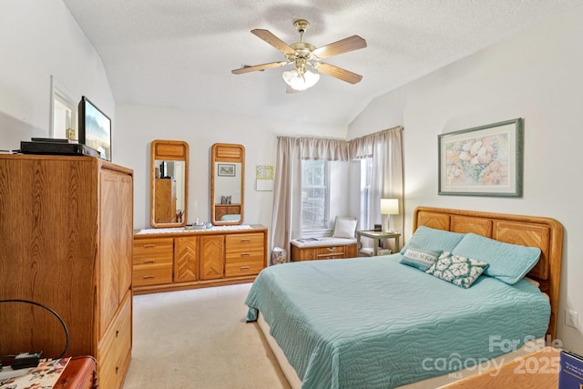 11100 Scrimshaw Ln, Charlotte, NC 28215 - bedroom with lofted ceiling, light colored carpet, ceiling fan, and a textured ceiling