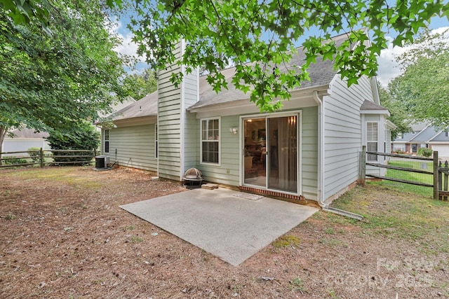 11100 Scrimshaw Ln, Charlotte, NC 28215 - back of property with a patio area, a shingled roof, and a chimney