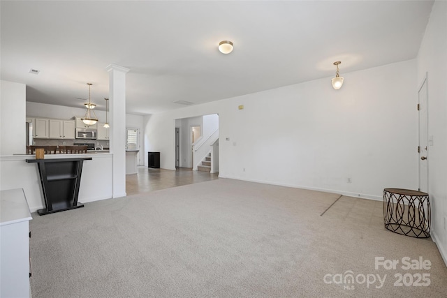 1287 Century Dr, Clover, SC 29710 - unfurnished living room with light carpet and stairway