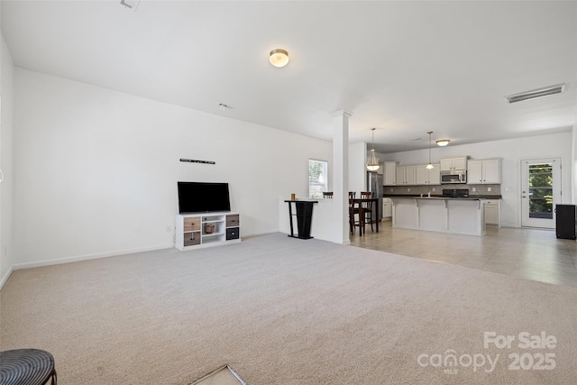 1287 Century Dr, Clover, SC 29710 - unfurnished living room featuring light carpet and baseboards