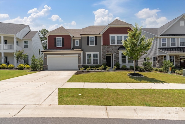 2225 Masons Bend Dr, Fort Mill, SC 29708 - view of front of house featuring stone siding, concrete driveway, an attached garage, and a front yard