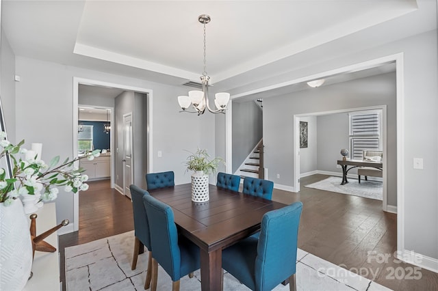 2225 Masons Bend Dr, Fort Mill, SC 29708 - dining room featuring a raised ceiling, a chandelier, and hardwood / wood-style floors