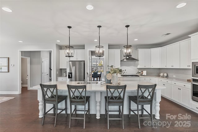 2225 Masons Bend Dr, Fort Mill, SC 29708 - kitchen with stainless steel appliances, a kitchen island, recessed lighting, tasteful backsplash, and light countertops