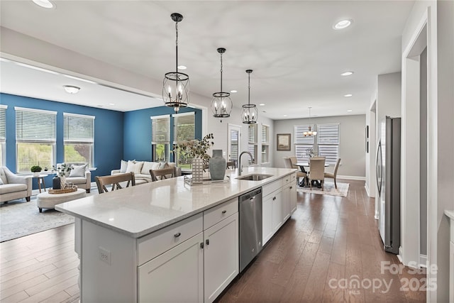 2225 Masons Bend Dr, Fort Mill, SC 29708 - kitchen featuring appliances with stainless steel finishes, open floor plan, white cabinets, dark wood-style flooring, and recessed lighting