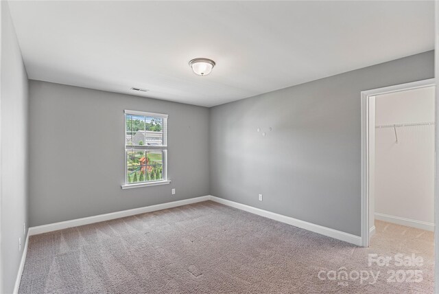 2225 Masons Bend Dr, Fort Mill, SC 29708 - unfurnished bedroom with carpet flooring and a walk in closet