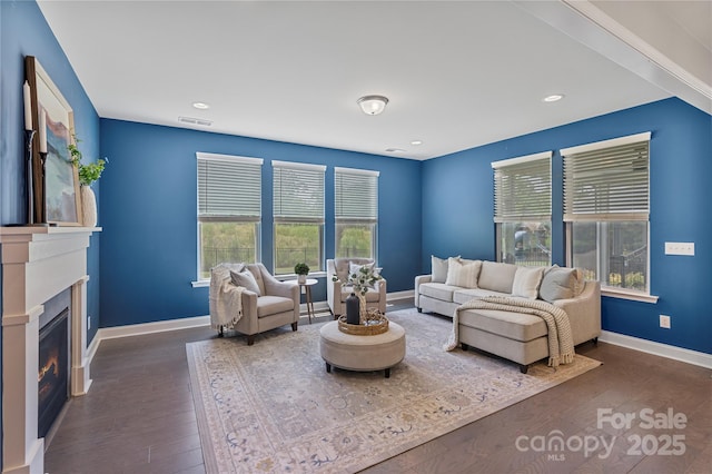 2225 Masons Bend Dr, Fort Mill, SC 29708 - living room featuring wood finished floors, a glass covered fireplace, and recessed lighting