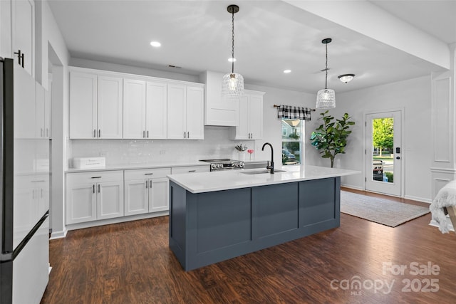 305 Redberry Ct, York, SC 29745 - kitchen with freestanding refrigerator, dark wood-type flooring, stainless steel stove, white cabinetry, and recessed lighting