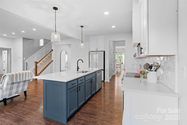 305 Redberry Ct, York, SC 29745 - kitchen featuring dark wood-style floors, dishwasher, white cabinets, recessed lighting, and blue cabinetry