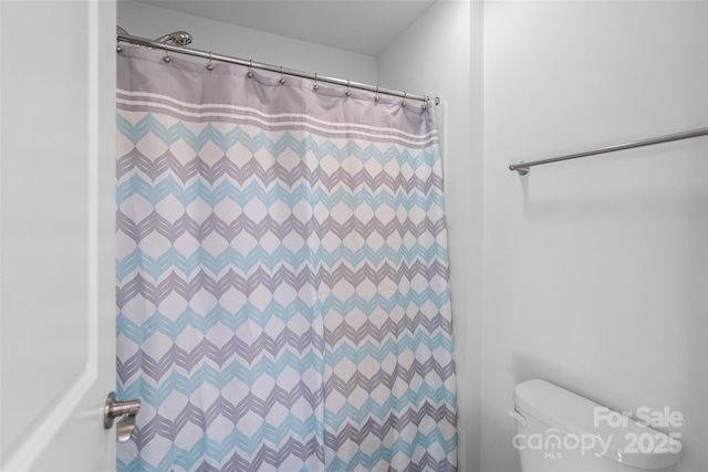 305 Redberry Ct, York, SC 29745 - bathroom with toilet and a shower with shower curtain