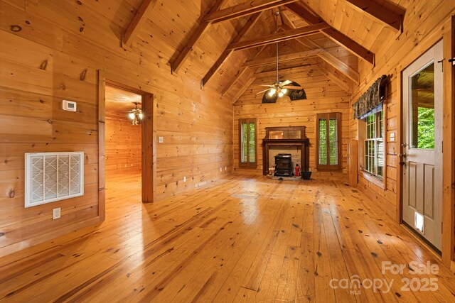 41 Waya Way, Whittier, NC 28789 - unfurnished living room featuring hardwood / wood-style floors, wood walls, a wood ceiling with exposed beams, ceiling fan, and high vaulted ceiling