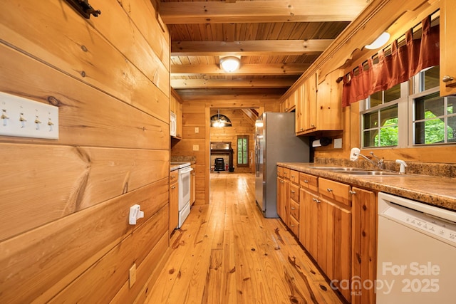 41 Waya Way, Whittier, NC 28789 - kitchen with white appliances, a wooden ceiling with exposed beams, wooden walls, light wood-type flooring, and brown cabinets