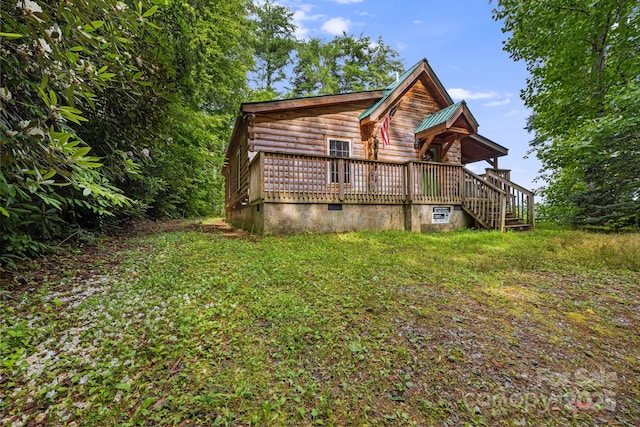41 Waya Way, Whittier, NC 28789 - view of front facade with crawl space and a wooden deck