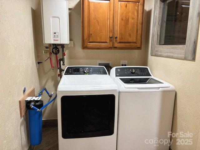 535 Lafayette Pl, Carthage, NC 28327 - washroom with tankless water heater, cabinet space, washing machine and dryer, wood finished floors, and a textured wall