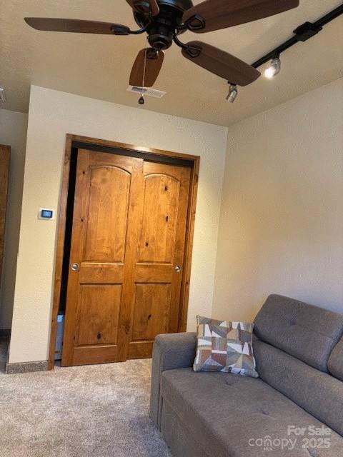 535 Lafayette Pl, Carthage, NC 28327 - living area with ceiling fan and carpet flooring