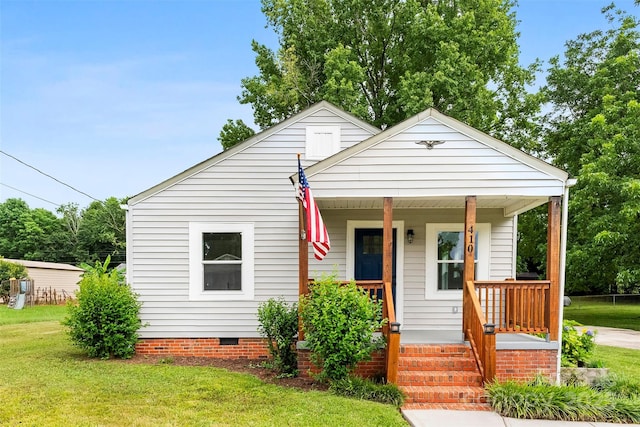 410 Gann St, Lowell, NC 28098 - bungalow-style home with covered porch, a front yard, and crawl space