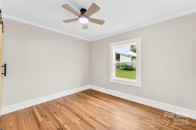 410 Gann St, Lowell, NC 28098 - unfurnished room featuring light wood-type flooring, crown molding, and a ceiling fan