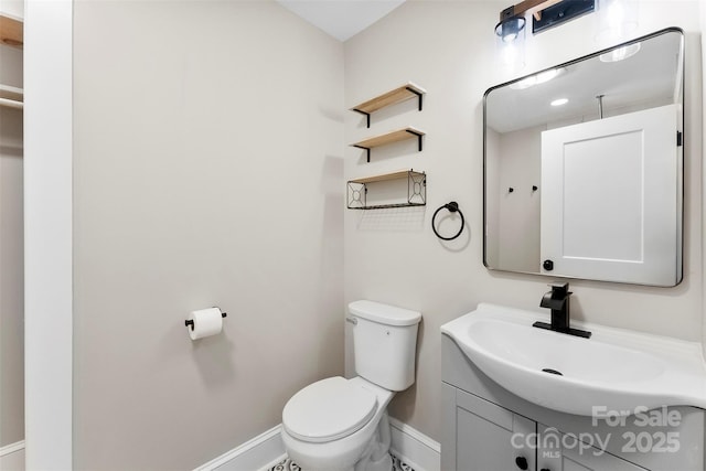 410 Gann St, Lowell, NC 28098 - half bath featuring baseboards and vanity