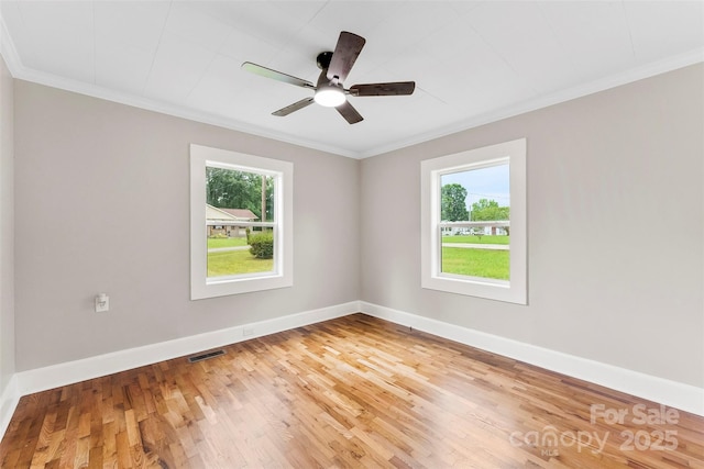 410 Gann St, Lowell, NC 28098 - unfurnished room featuring crown molding, wood finished floors, and ceiling fan