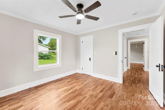 410 Gann St, Lowell, NC 28098 - empty room with light wood-style flooring, crown molding, ceiling fan, and attic access