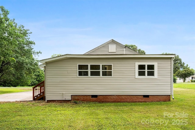 410 Gann St, Lowell, NC 28098 - view of property exterior with crawl space and a lawn
